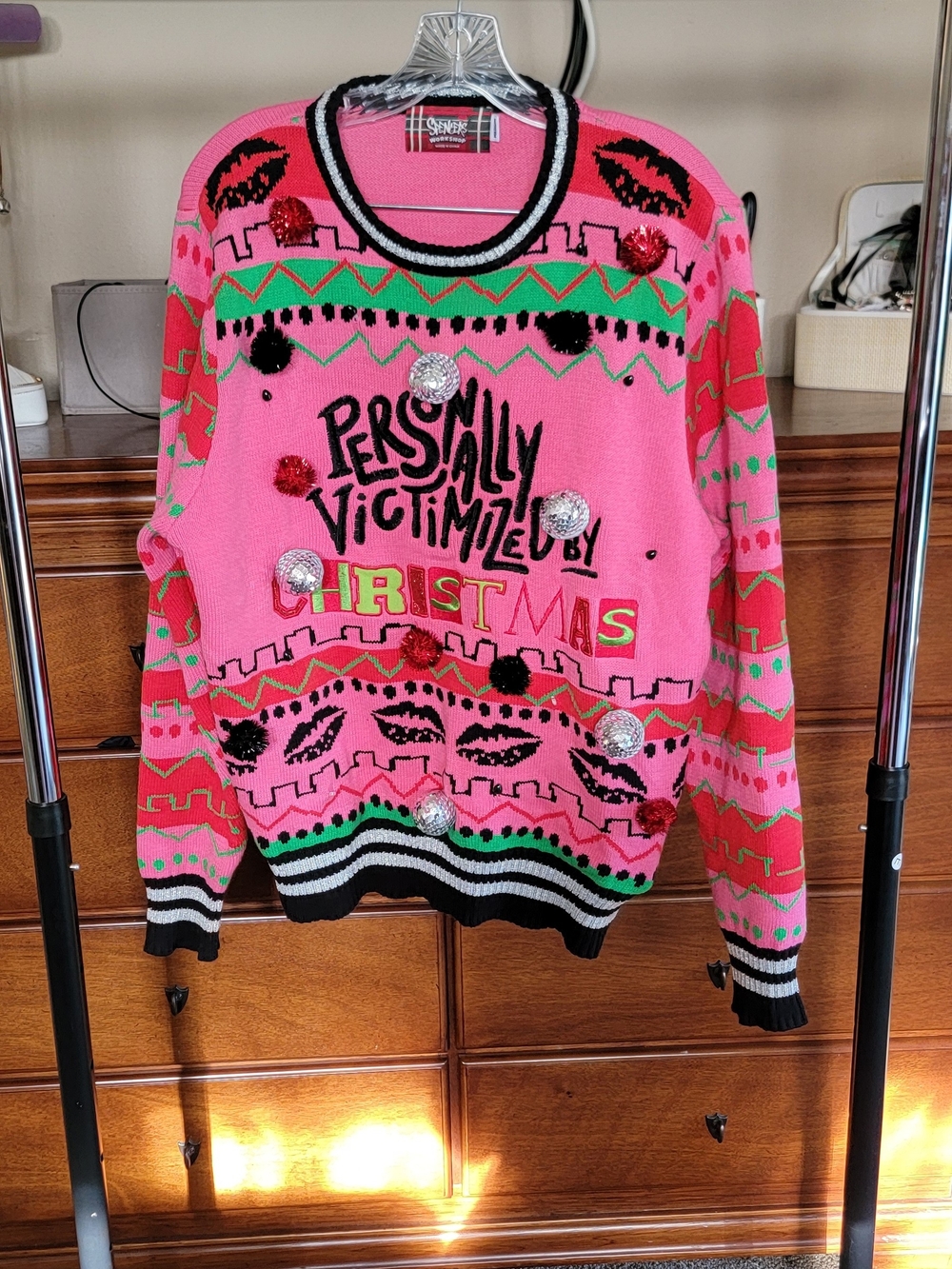 Spencer's Bright Pink 'Personally Victimized by Christmas' Crewneck Sweater